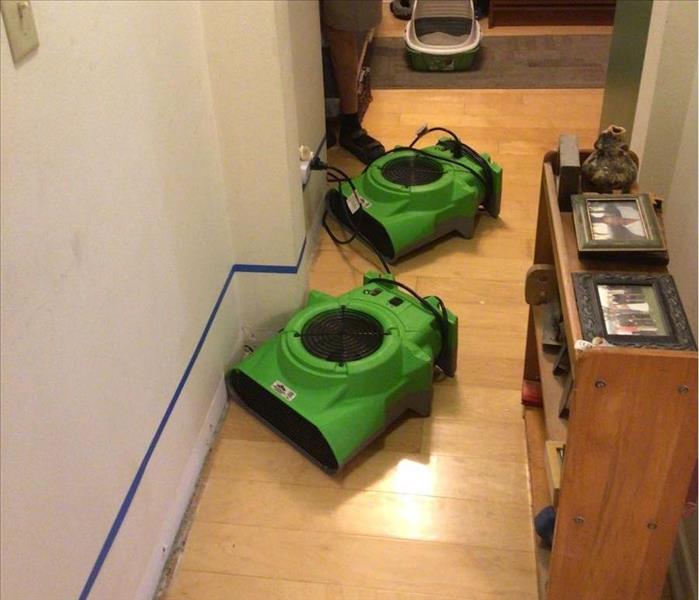 Water damage equipment on floor.