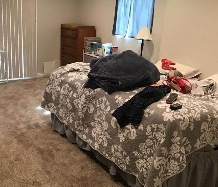 wet carpet in a bedroom
