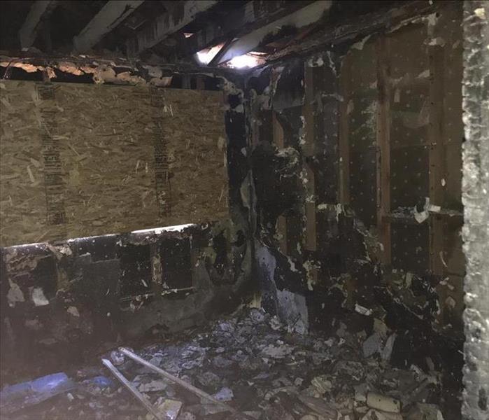 bedroom boarded up after severe fire damage