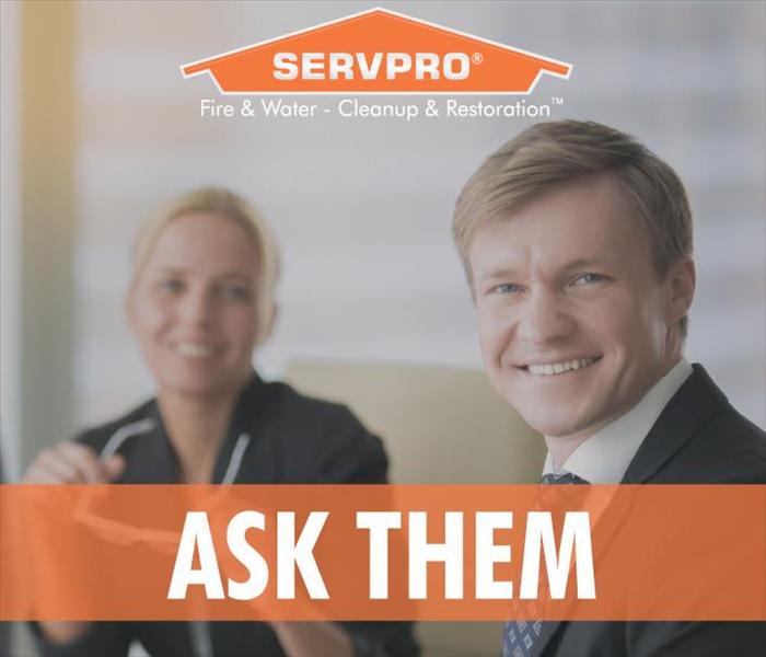 A male and female office worker smiling, Servpro logo and the phrase ASK THEM.